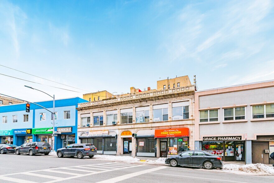 Neighborhood storefronts at 493–495 South Broadway