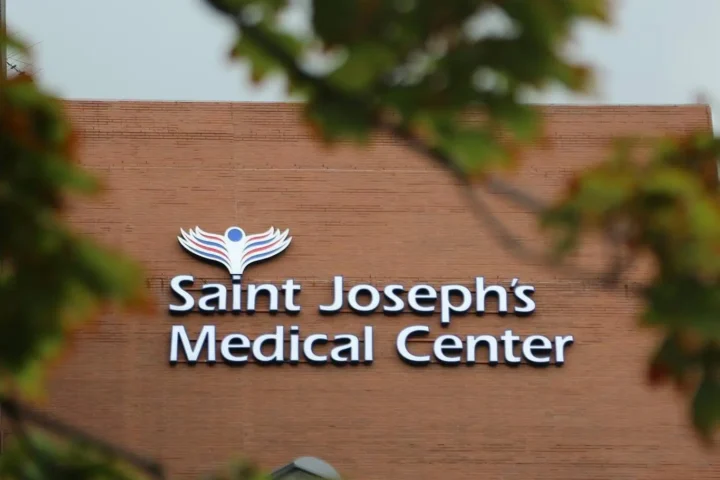 Saint Joseph's Medical Center sign on a brick building